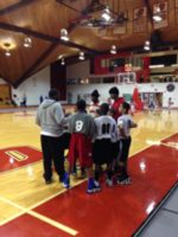 Team hudle at the Kline Center